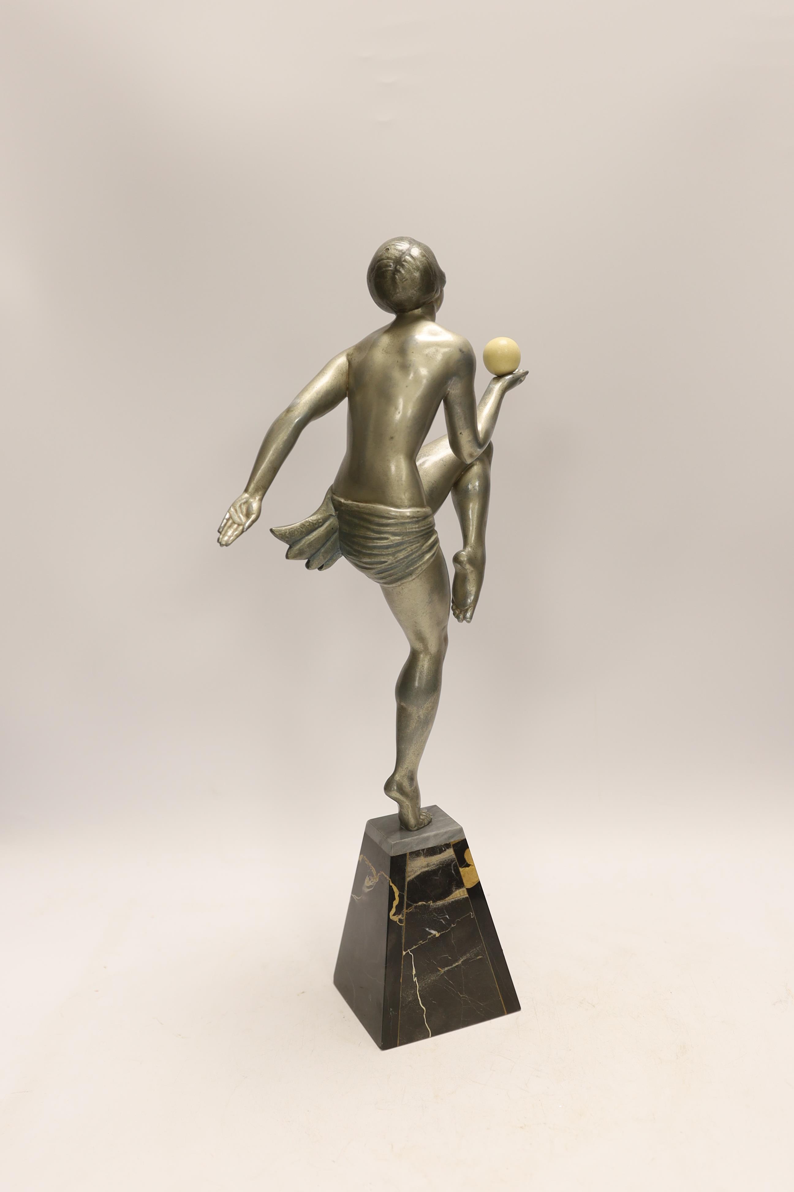 An Art Deco spelter and marble model of a dancing lady with ball, 44cm. Condition - good